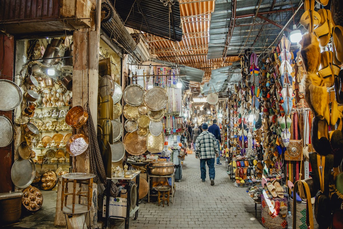 A bustling marketplace in Marrakech, Morocco at dusk